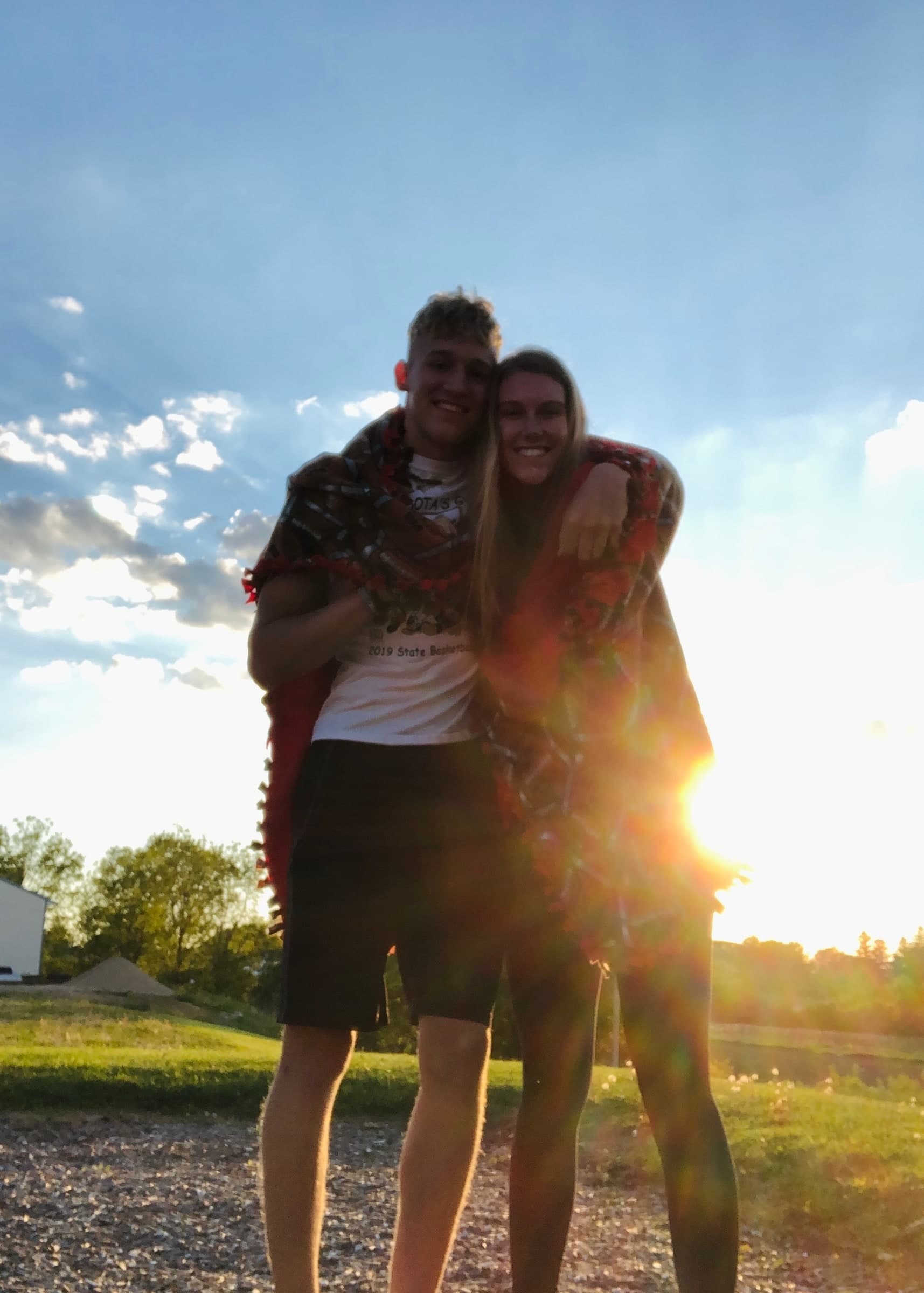 Tysen and Alyssa embracing at sunset on the day they began dating